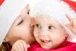 11181725-happy-christmas-mother-kissing-daughter-on-a-white-background